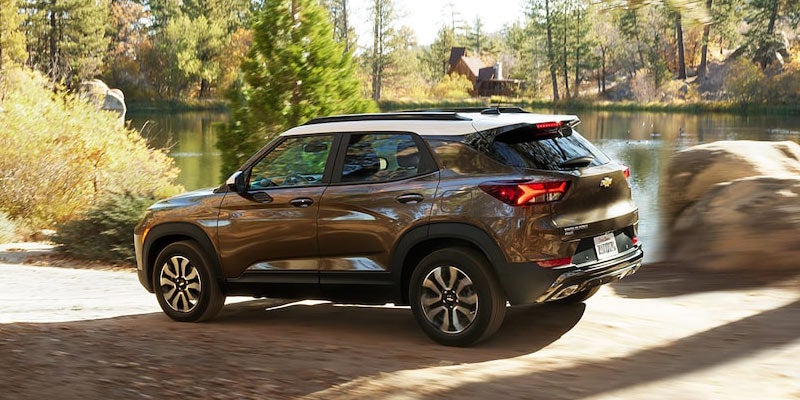 Car running besides lake