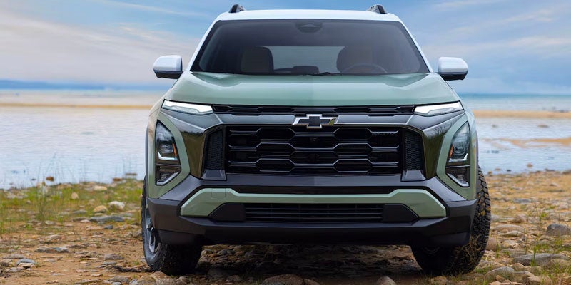 2025 Chevrolet Equinox parked on the side of the lake.